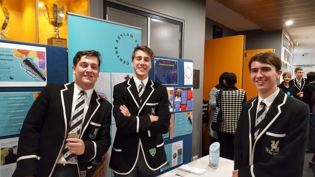 Dominic Young, Phillip Langshaw and Thomas Newham selling raffle tickets at the Asylum Seekers Centre Improv night 2018